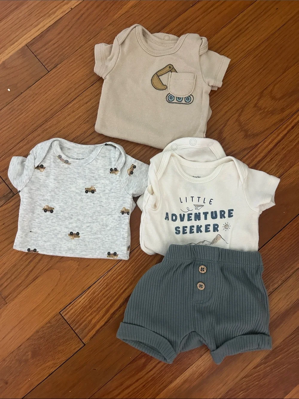 Carters Newborn clothes bundle-3 onesies and 1 pair of shorts